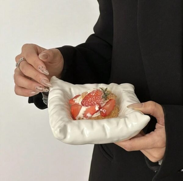 Cream-white ceramic mug with engraved diamond-like lines, diamond-shaped handle, and cushion-like saucer, dishwasher & microwave safe