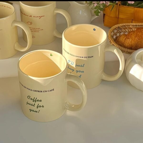 Yellow ceramic mug with classic shape and text “Coffee just for U … envie de vous offrir un café,” dishwasher and microwave safe