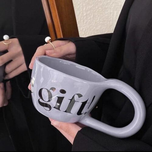 Large purple ceramic mug with stretched handle and engraved text “Feel Like Gift,” dishwasher and microwave safe
