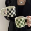 Ceramic checkered mug with rounded handle, 300ml capacity, chessboard-inspired design, dishwasher and microwave safe